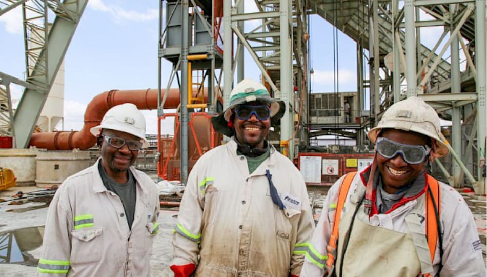 Image of Three Ivanhoe Mine Workers at Platreef Mine Site